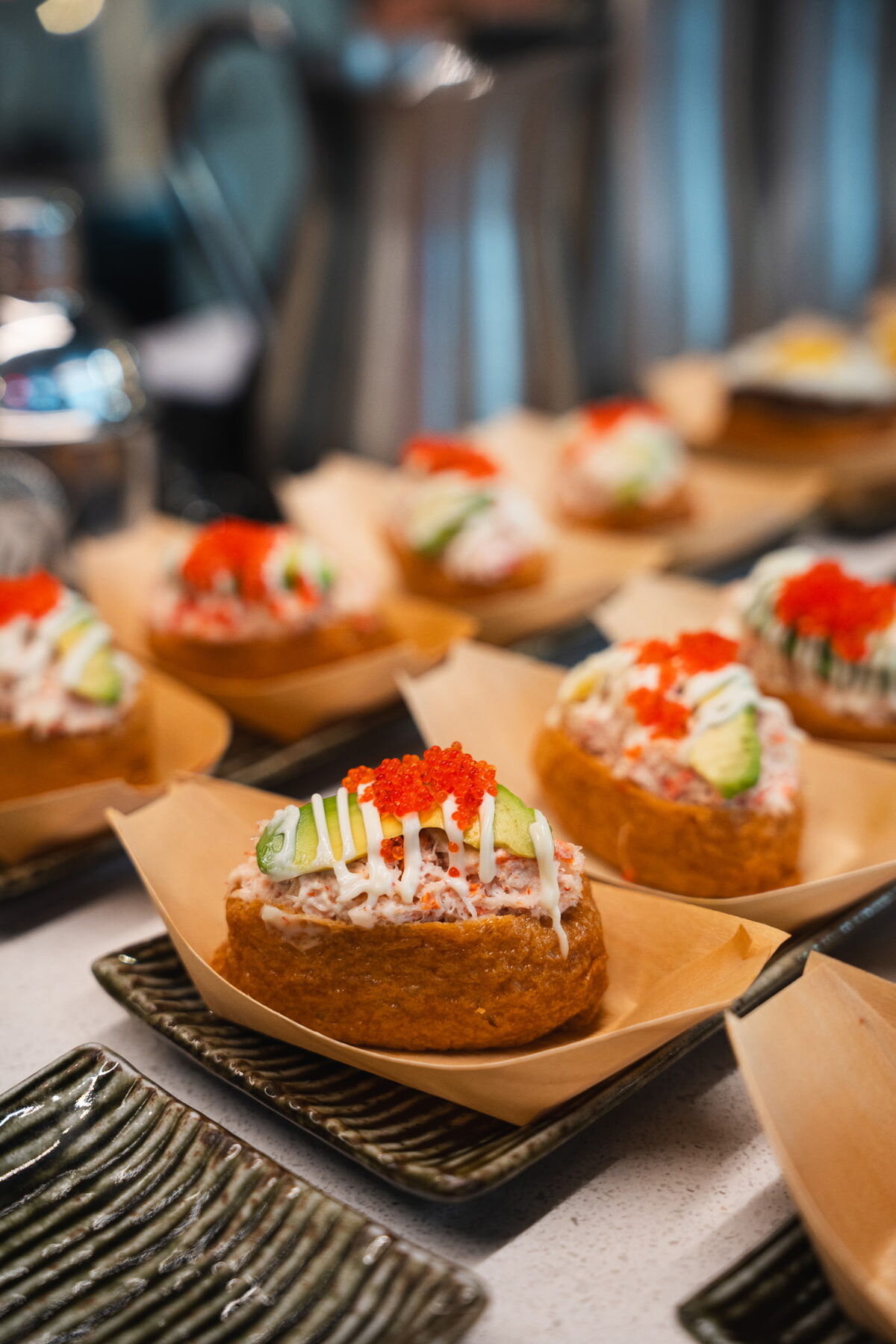 Snow crab inari, lined up for service